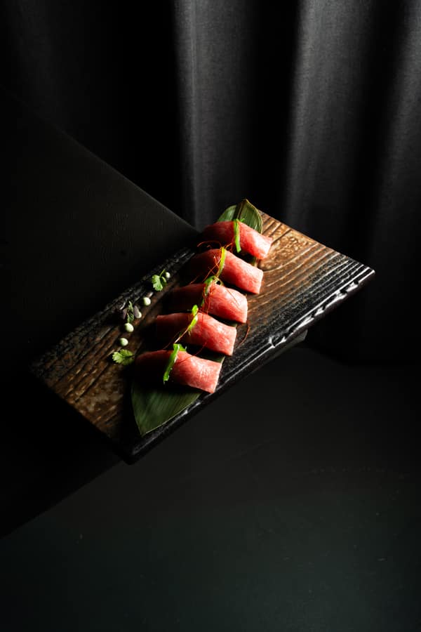 Bluefin tuna cuts served on a wooden board