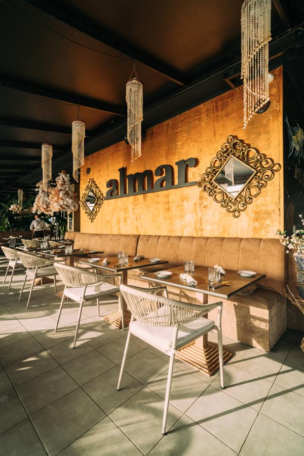Dining room with the golden Almar sign