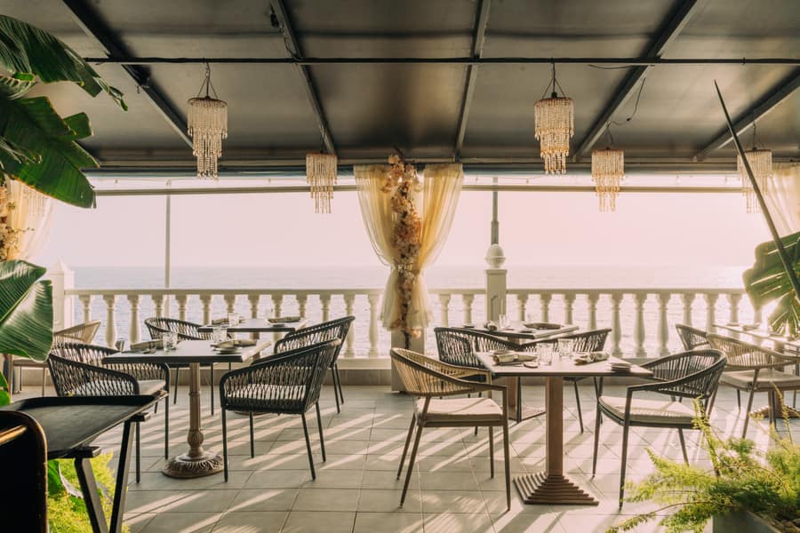 Terrace with hanging lamps facing the sea